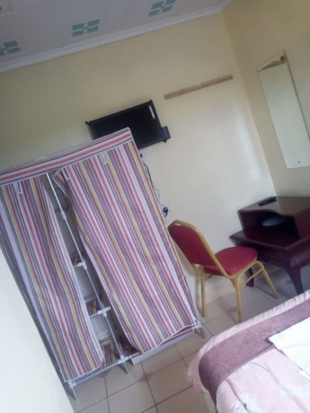 Imagen de la habitación del Hotel Senior Chief Wambugu Palace. Foto 17