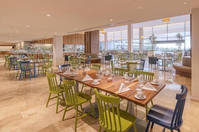 Imagen del bar/restaurante del Hotel Sensira Resort & Spa Riviera Maya All Inclusive. Foto 2