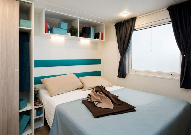 Imagen de la habitación del Hotel Sereno Camping Holiday. Foto 21
