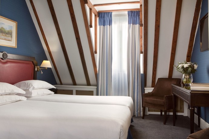 Imagen de la habitación del Hotel Serotel Lutèce. Foto 13