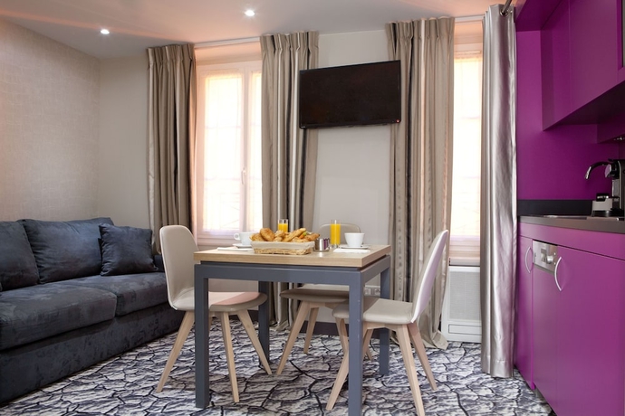 Imagen de la habitación del Hotel Serotel Suites Opera. Foto 9