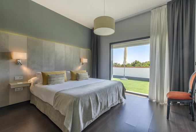 Imagen de la habitación del Hotel Sevilla Green Suites. Foto 6