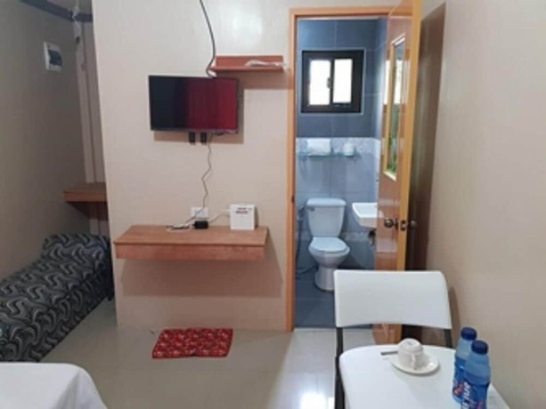 Imagen de la habitación del Hotel Shalom Guest House And Resto Bar. Foto 12