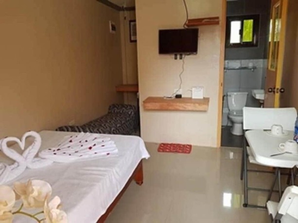 Imagen de la habitación del Hotel Shalom Guest House And Resto Bar. Foto 18