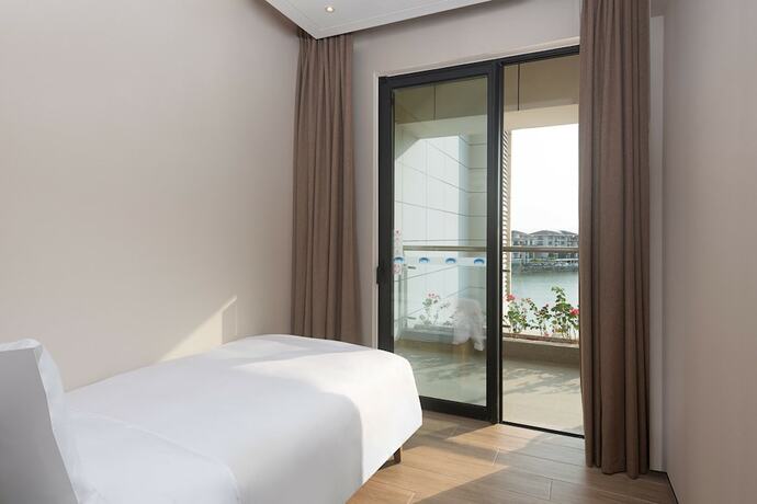 Imagen de la habitación del Hotel Shama Yalong Bay Sanya. Foto 4