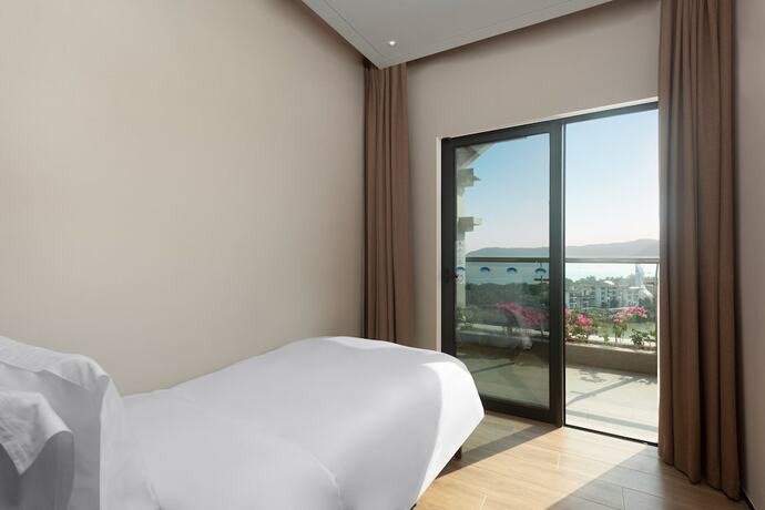 Imagen de la habitación del Hotel Shama Yalong Bay Sanya. Foto 14
