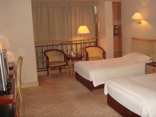Imagen de la habitación del Hotel Shandong Aviation Mansion. Foto 3