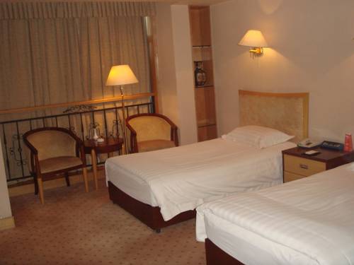 Imagen de la habitación del Hotel Shandong Aviation Mansion. Foto 4