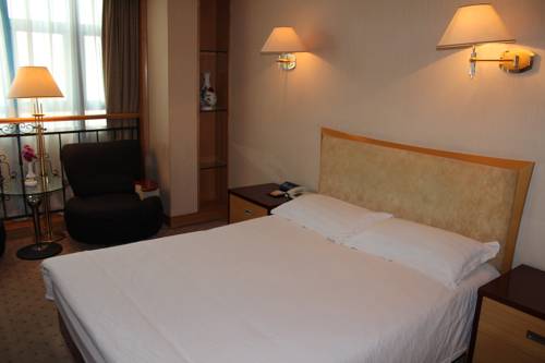 Imagen de la habitación del Hotel Shandong Aviation Mansion. Foto 5