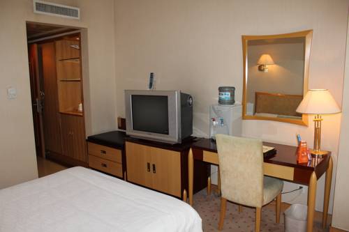 Imagen de la habitación del Hotel Shandong Aviation Mansion. Foto 6