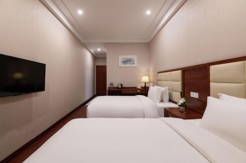 Imagen de la habitación del Hotel ShangHai LuAn Garden. Foto 13