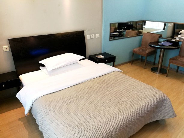Imagen de la habitación del Hotel Shanghai Abest Xinshikong Apartments. Foto 4