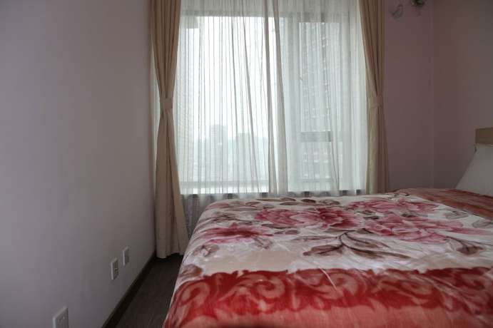 Imagen de la habitación del Hotel Shanghai Abest Xinshikong Apartments. Foto 11
