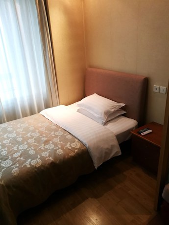 Imagen de la habitación del Hotel Shanghai Abest Xinshikong Apartments. Foto 14