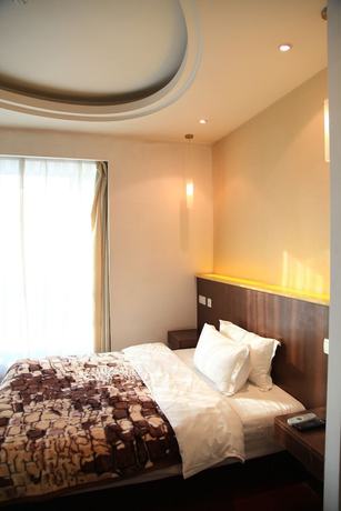 Imagen de la habitación del Hotel Shanghai Abest Xinshikong Apartments. Foto 15