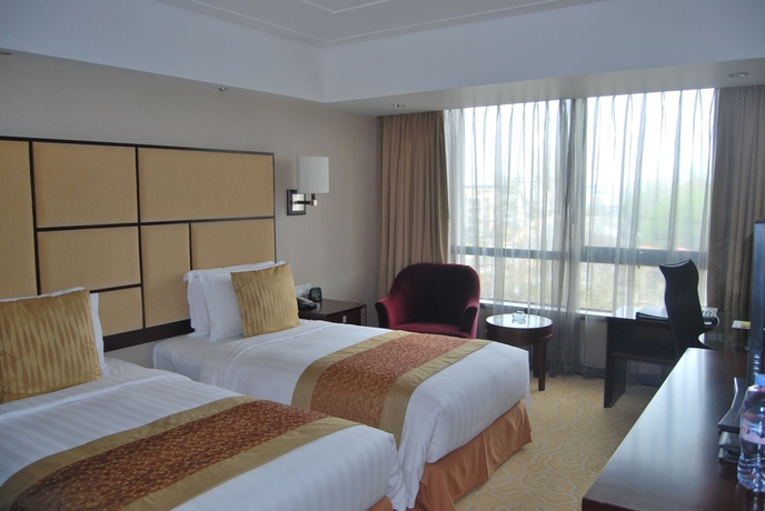 Imagen de la habitación del Hotel Shanghai Baixia Pagoda. Foto 10