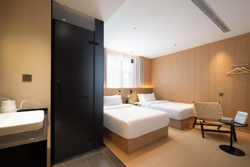 Imagen de la habitación del Hotel Shanghai Captain 5 Youth - Xinzhuang Metro Station. Foto 15