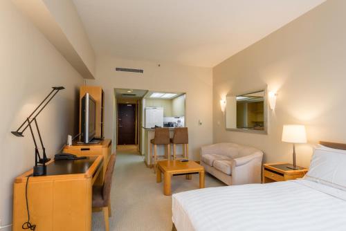 Imagen de la habitación del Hotel Shanghai Centre Serviced Apartment. Foto 6