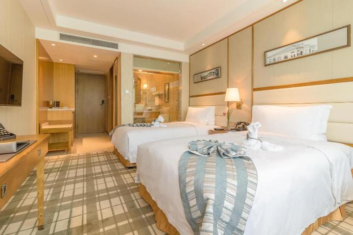 Imagen de la habitación del Hotel Shanghai Fliport Garden. Foto 10