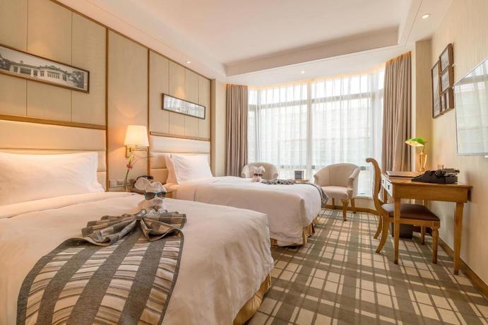 Imagen de la habitación del Hotel Shanghai Fliport Garden. Foto 11