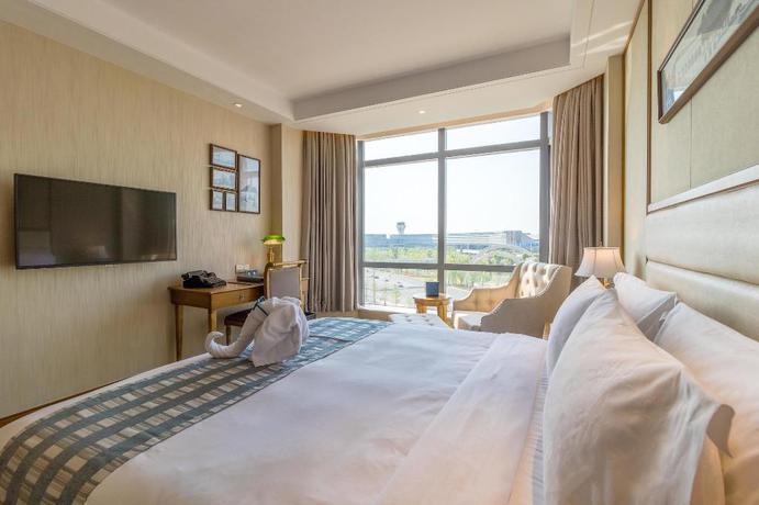 Imagen de la habitación del Hotel Shanghai Fliport Garden. Foto 13