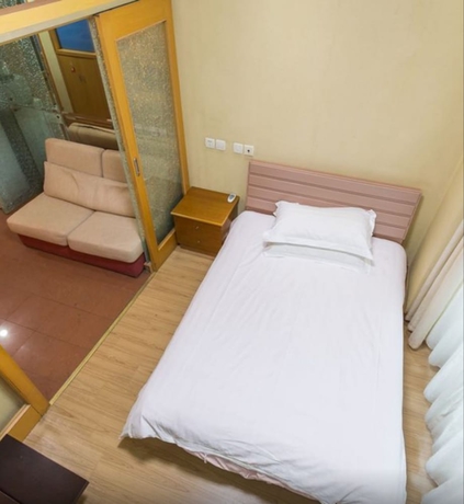 Imagen de la habitación del Hotel Shanghai Friendship Apartment. Foto 15