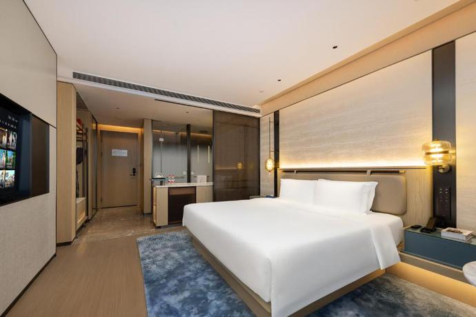 Imagen de la habitación del Hotel Shanghai Hongqiao Heyitang. Foto 8