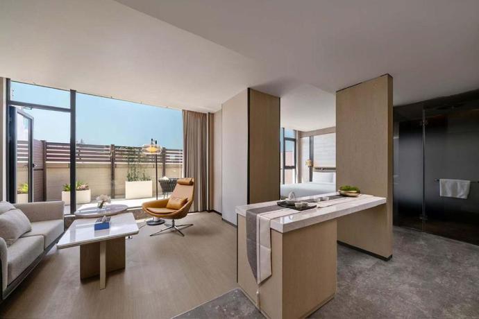 Imagen de la habitación del Hotel Shanghai Hongqiao Heyitang. Foto 9
