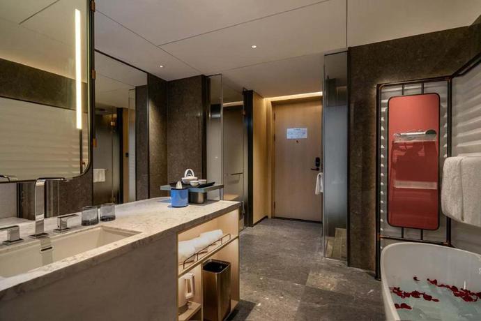 Imagen de la habitación del Hotel Shanghai Hongqiao Heyitang. Foto 10
