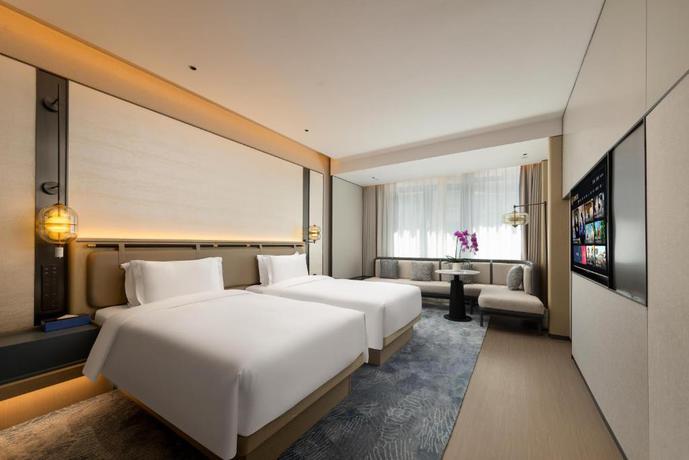 Imagen de la habitación del Hotel Shanghai Hongqiao Heyitang. Foto 12