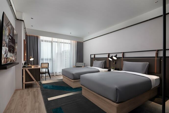 Imagen de la habitación del Hotel Shanghai Hongqiao Tongpai. Foto 11