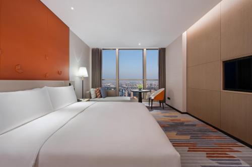 Imagen de la habitación del Hotel Shanghai Jinli Qube. Foto 16