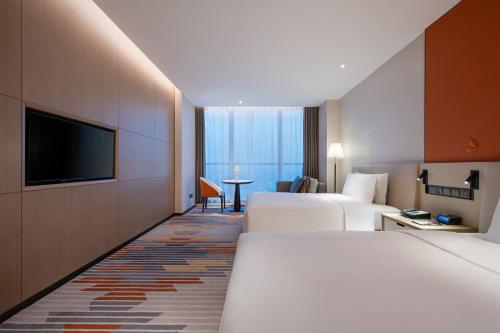 Imagen de la habitación del Hotel Shanghai Jinli Qube. Foto 17
