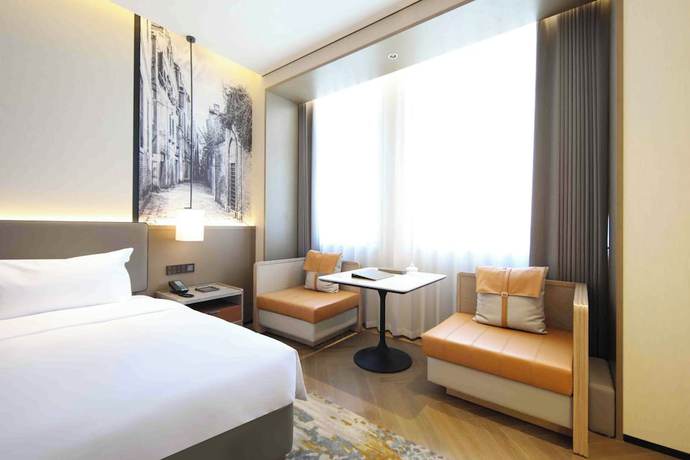 Imagen de la habitación del Hotel Shanghai Kacunm. Foto 4