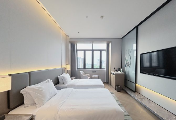 Imagen de la habitación del Hotel Shanghai Kacunm. Foto 6