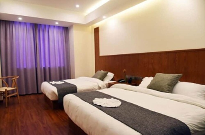 Imagen de la habitación del Hotel Shanghai Linyin Holiday. Foto 3