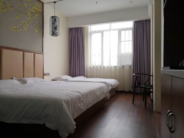 Imagen de la habitación del Hotel Shanghai Linyin Holiday. Foto 16