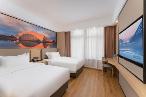 Imagen general del Hotel Shanghai Manhua-Provides free shuttle service to Disneyland. Foto 3