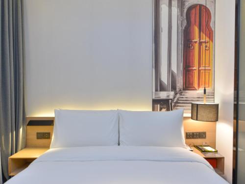 Imagen de la habitación del Hotel Shanghai Pudong Airport Chuansha Atour. Foto 7