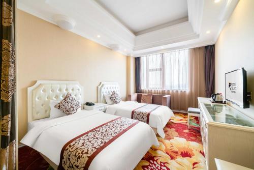 Imagen de la habitación del Hotel Shanghai Pudong Airport Resort Licheng Ruixuan. Foto 17