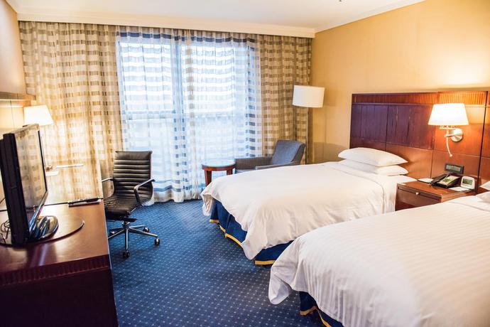 Imagen de la habitación del Hotel Shanghai Qilu. Foto 7