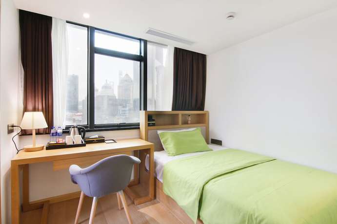 Imagen de la habitación del Hotel Shanghai Sweetome Vacation Apartment East Nanjing Road. Foto 10
