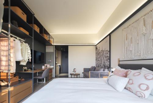 Imagen de la habitación del Hotel Shanghai T Plus Residence. Foto 19