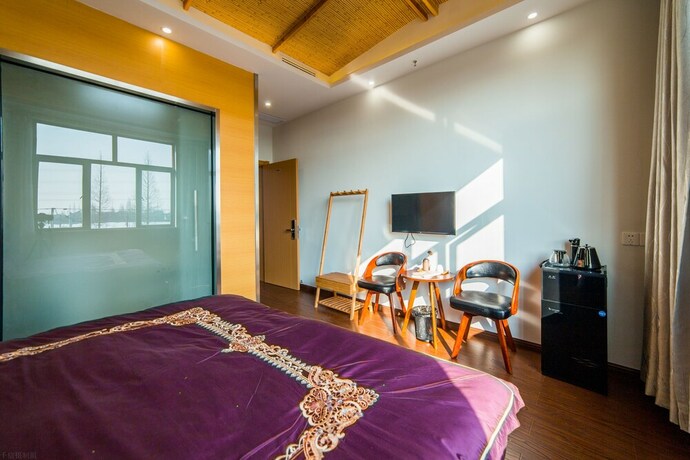 Imagen de la habitación del Hotel Shanghai Xiaer Xili Manor. Foto 12