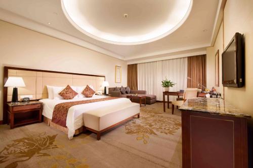 Imagen de la habitación del Hotel Shanghai Yuehua. Foto 15