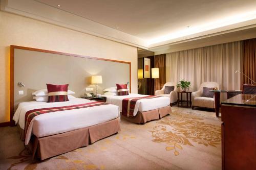 Imagen de la habitación del Hotel Shanghai Yuehua. Foto 16
