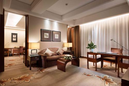 Imagen de la habitación del Hotel Shanghai Yuehua. Foto 17