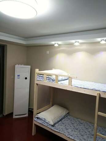 Imagen de la habitación del Hotel Shanghai Yuelai Guest House - Hostel. Foto 9