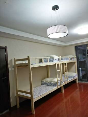 Imagen de la habitación del Hotel Shanghai Yuelai Guest House - Hostel. Foto 13