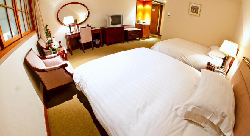 Imagen de la habitación del Hotel Shanghai Zhong Dian Hotel. Foto 5